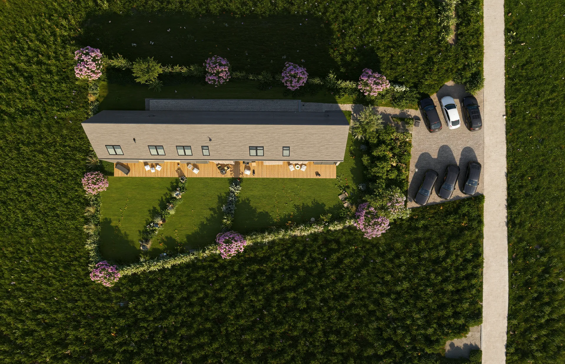 Pohled shora na projekt Za lány se třemi samostatnými byty, terasami, soukromými zahradami a parkovacími místy.
